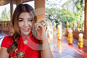 Chinese woman dressing red traditional cheongsam style ,close up