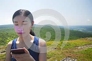 Chinese woman eyes shut alander mountain summit