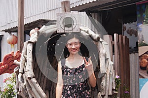 Chinese woman flashing a peace sign