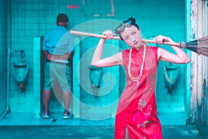 Chinese woman is getting ready to clean up male dirty toilet