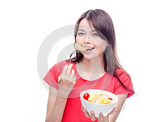 Chinese woman holding bowl of fruit