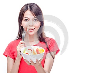 Chinese woman holding bowl of fruit