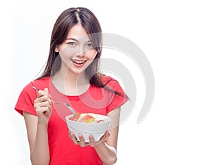 Chinese woman holding bowl of fruit