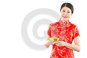 Chinese woman holding golden ingot