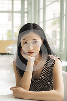 Chinese woman inside a room near windows photo