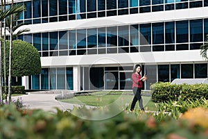 Chinese Woman With Phone Walking And Drinking Coffee