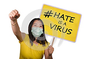 Chinese woman protestor with hate is a virus billboard - young upset Korean woman in anti covid19 mask holding banner with message