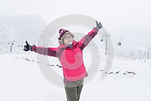 Chinese woman thumbs up, enjoying winter