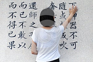 Chinese woman touching laozhi taoism teachings