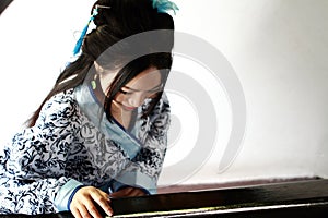 Chinese woman in traditional Blue and white Hanfu dress Stand on the stairs