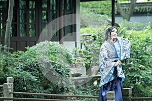 Chinese woman in traditional Blue and white porcelain style Hanfu dress