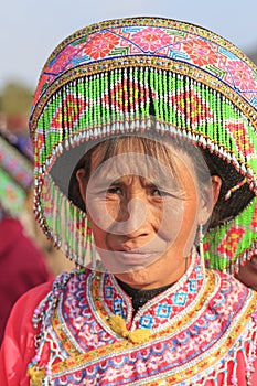 Chinese woman in traditional Miao attire during the Heqing Qifeng Pear Flower festival