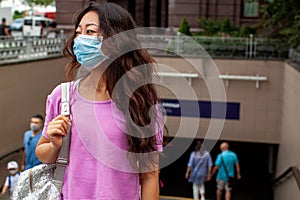 Chinese Woman Wearing Surgical Mask Near Train Or Bus Station