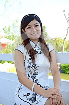 Chinese woman wearing white cheongsam photo