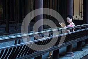 A Chinese woman wears traditional dress in the water park of Shanghai