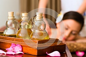 Chinese Woman at wellness massage with essential oils