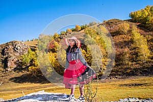 Chinese Women Traveling on the Autumn Grassland