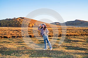 Chinese Women Traveling on the Autumn Grassland