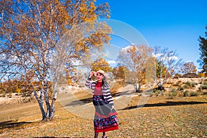 Chinese Women Traveling on the Autumn Grassland