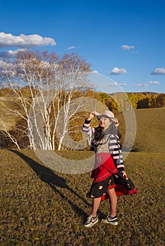 Chinese Women Traveling on the Autumn Grassland