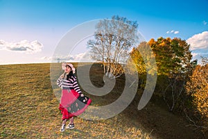 Chinese Women Traveling on the Autumn Grassland