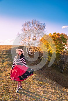 Chinese Women Traveling on the Autumn Grassland