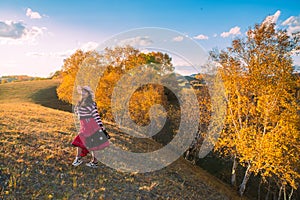 Chinese Women Traveling on the Autumn Grassland