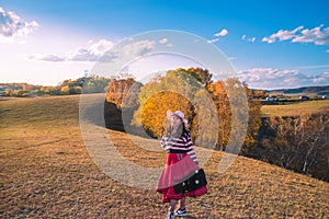 Chinese Women Traveling on the Autumn Grassland