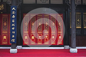 Chinese Wooden Doors with Decorated Panels and Windows.