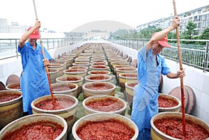 Chinese worker making Pixian Horsebean Chili Paste