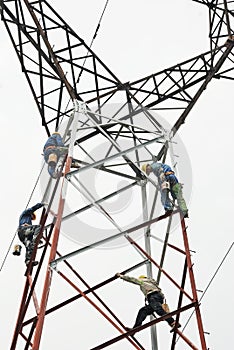 Chinese worker painting steel structure