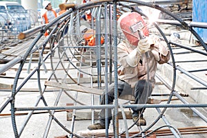 Chinese worker welding steel