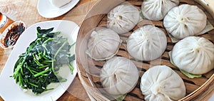 Chinese Xiao long bao with stir fried spinach.