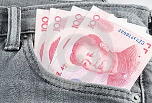 Chinese yuan banknote in the grey jean pocket