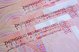 Chinese yuan banknotes placed on top of each other