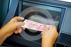 Chinese yuan issuing by ATM on hand