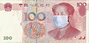 Chinese Yuan with Mao Zedong in a medical mask. Coronavirus COVID-19 epidemic concept. World financial crisis.