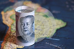 Chinese yuan on the map of South America photo