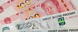 Chinese yuan and Russian ruble banknotes