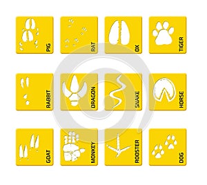 Chinese zodiac signs icons set on on a yellow square background. Paw prints marks , footprints of rat, mouse, snake, dragon, pig,