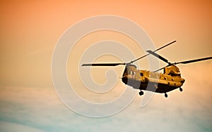 Chinook flying into the sunset photo