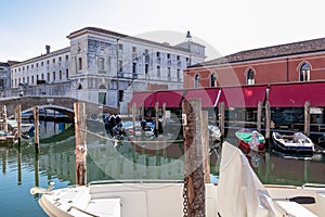 Chioggia - Scenic view of town hall and fish market along the enchanting Canal Vena in Chioggia photo