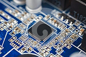 a chip in a computer with many electrical elements, a CPU, a GPU, a microchip in an electronic device, a multi-core multithreaded