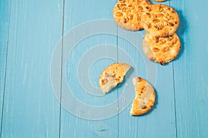 chip cookies with nuts on a blue wooden background/chip cookies with nuts on a blue wooden background, top view and copy space