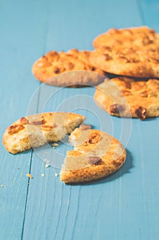 chip cookies with nuts/chip cookies with nuts on a blue wooden background, close up