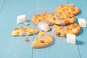 chip cookies with nuts and lump sugar/ chip cookies with nuts and lump sugar on a blue wooden background, selective focus