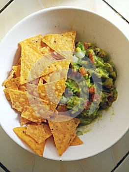 Chip and guacamole for meal photo