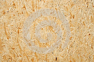 Chipboard texture background. Chipboard, particle board, engineered sheet wood made from small wood chippings.