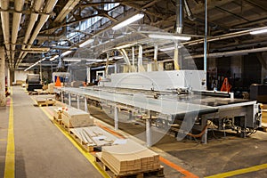 Chipboards on conveyer at furniture factory