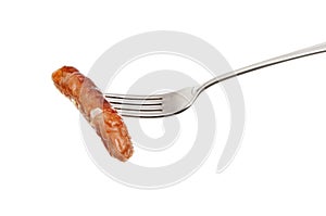 Chipolata sausage on a fork